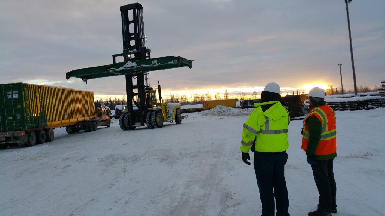 Shipping containers in snow representing global supply chain services