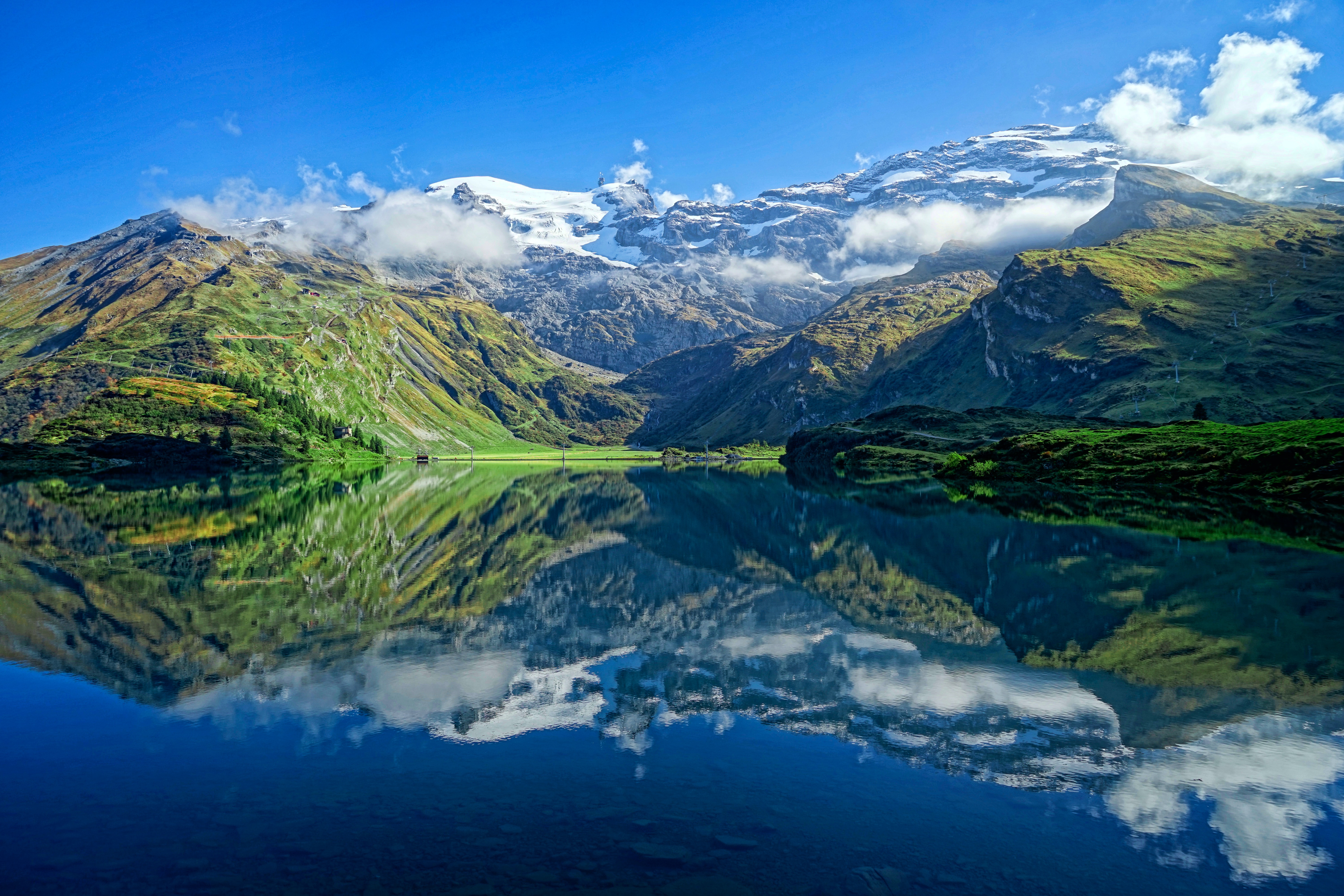 Green mountain and water landscape representing environmental management